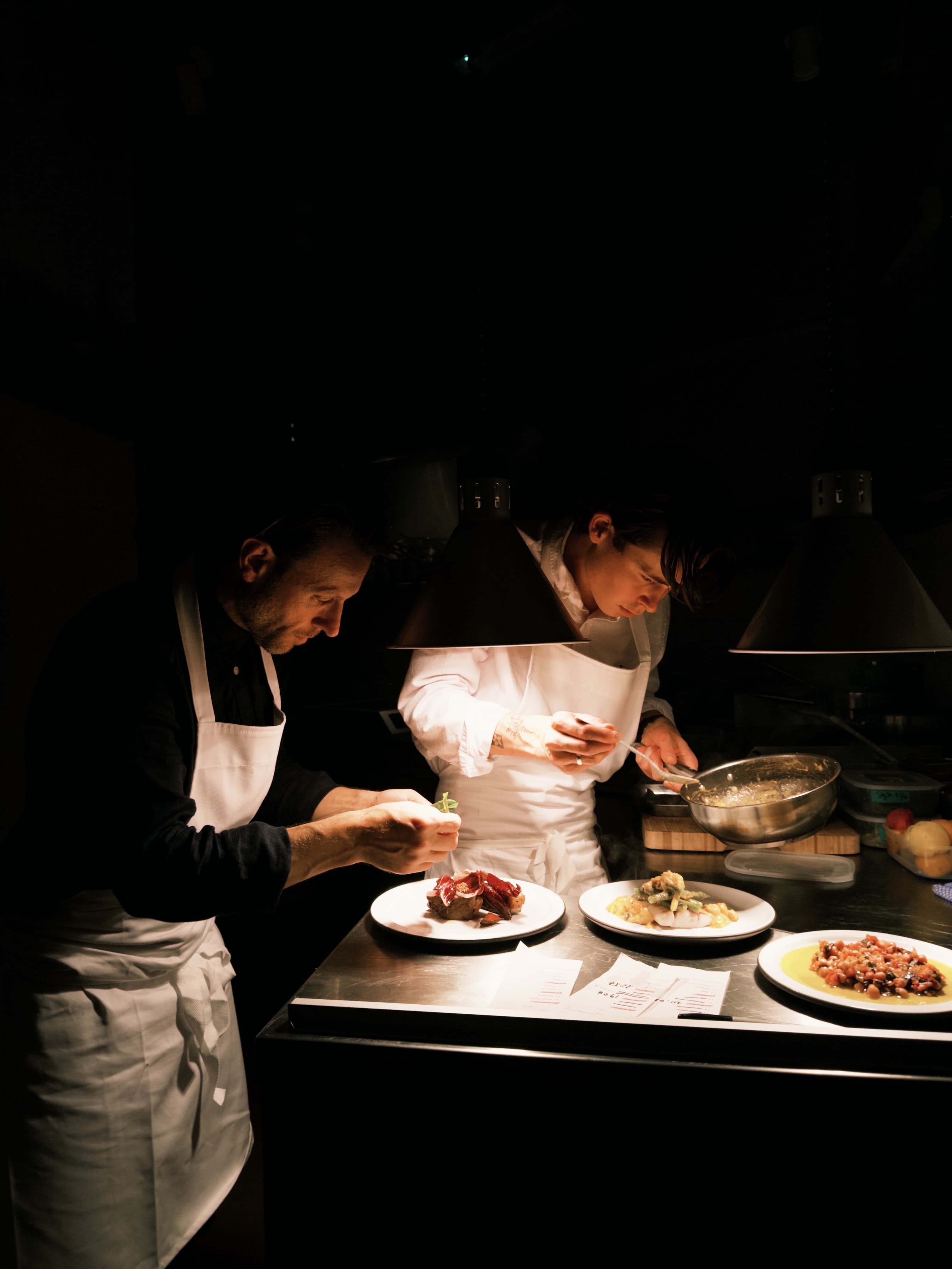 The kitchen team finishing plates